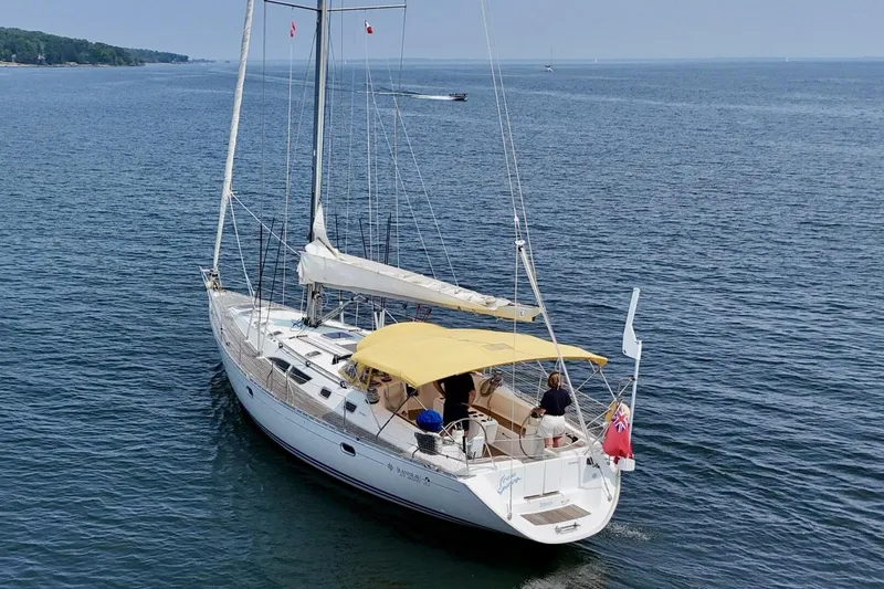 Free Spirits Yacht Photos Pics Jeanneau Sun Odyssey 45.2 sailboat from 2000 cruising on open water.