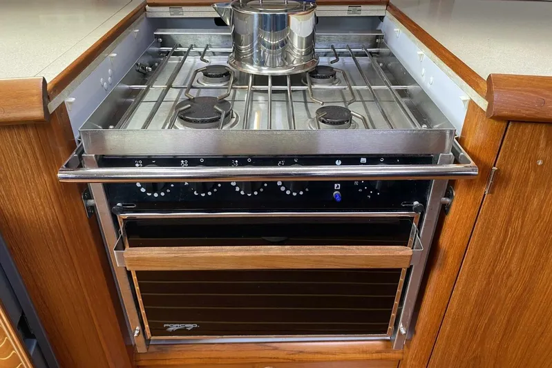 Free Spirits Yacht Photos Pics Stainless steel stove and oven in Jeanneau Sun Odyssey 45.2 yacht kitchen, 2000 model.