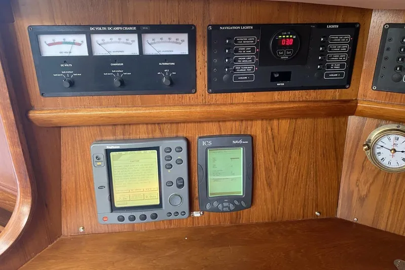 Free Spirits Yacht Photos Pics Control panel of a 2000 Jeanneau Sun Odyssey 45.2 sailboat with navigation instruments.