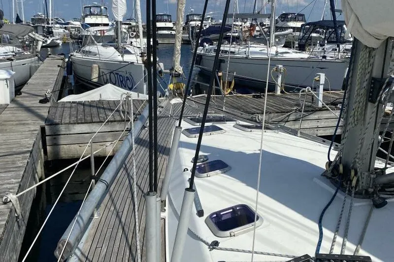 Free Spirits Yacht Photos Pics Jeanneau Sun Odyssey 45.2 sailboat docked at marina, 2000 model.