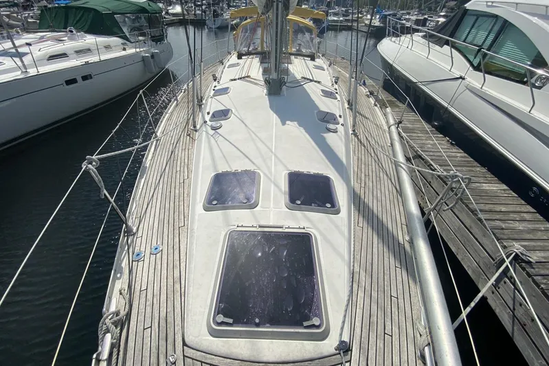 Free Spirits Yacht Photos Pics 2000 Jeanneau Sun Odyssey 45.2 sailboat docked, showcasing deck and hatches.