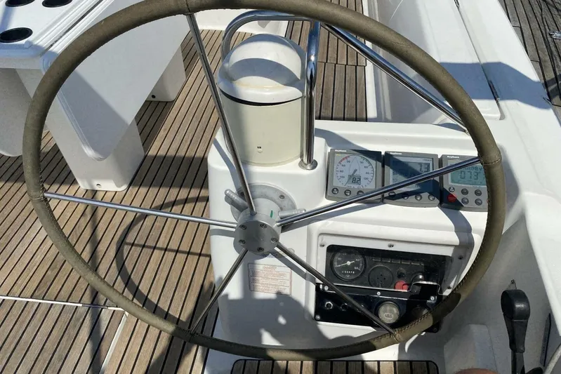 Free Spirits Yacht Photos Pics Steering wheel and controls of a 2000 Jeanneau Sun Odyssey 45.2 sailboat.