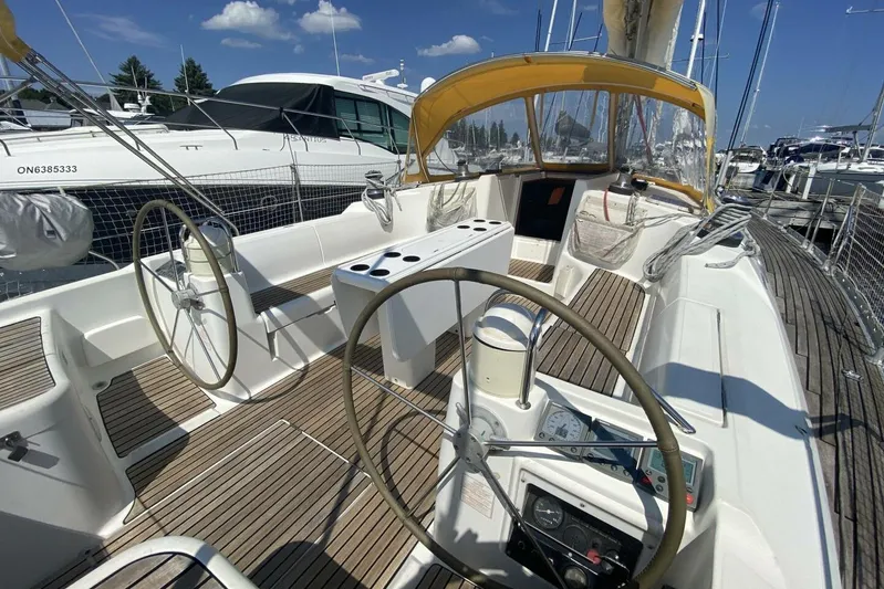 Free Spirits Yacht Photos Pics Cockpit of 2000 Jeanneau Sun Odyssey 45.2 sailboat with dual steering wheels.