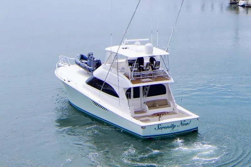 Serenity Now Yacht Photos Pics 2014 Viking 66 Convertible yacht on calm water, rear view.