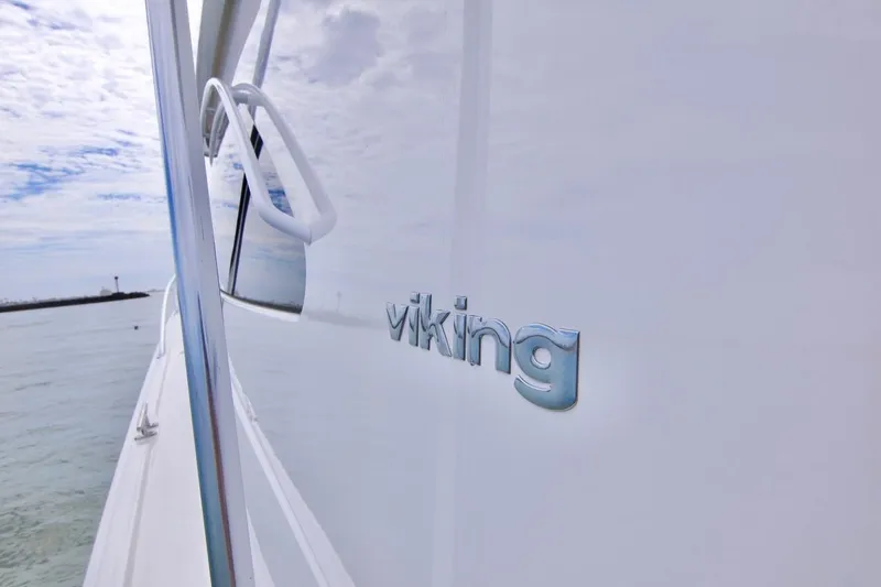 Serenity Now Yacht Photos Pics 2014 Viking 66 Convertible yacht on calm waters, showcasing sleek design.