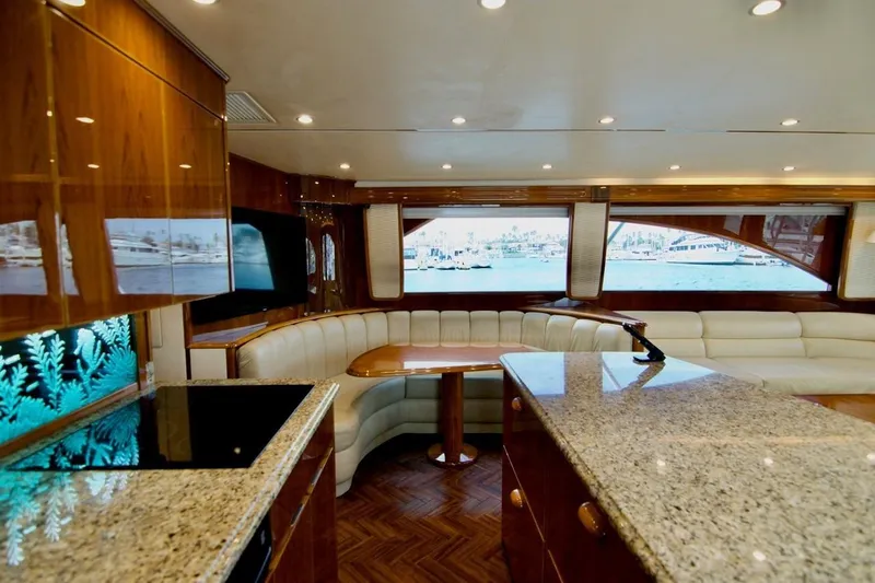 Serenity Now Yacht Photos Pics Luxurious interior of 2014 Viking 66 Convertible yacht with elegant seating and granite countertops.
