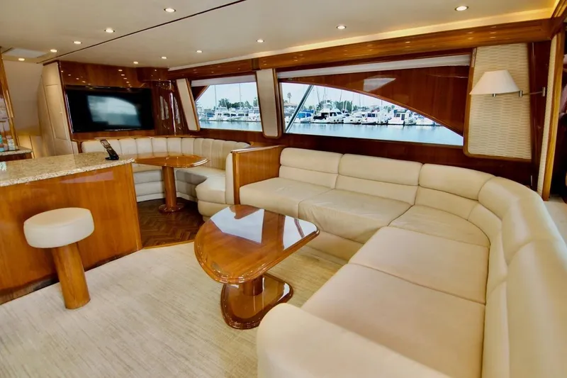 Serenity Now Yacht Photos Pics Luxurious interior of 2014 Viking 66 Convertible yacht with plush seating and elegant wood finishes.