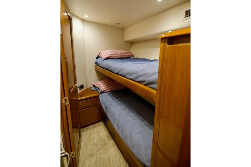 Serenity Now Yacht Photos Pics Bunk beds in 2014 Viking 66 Convertible yacht cabin with wooden finish.