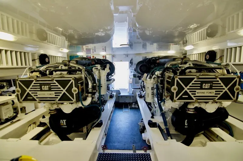 Serenity Now Yacht Photos Pics Engine room of 2014 Viking 66 Convertible yacht with CAT marine power engines.