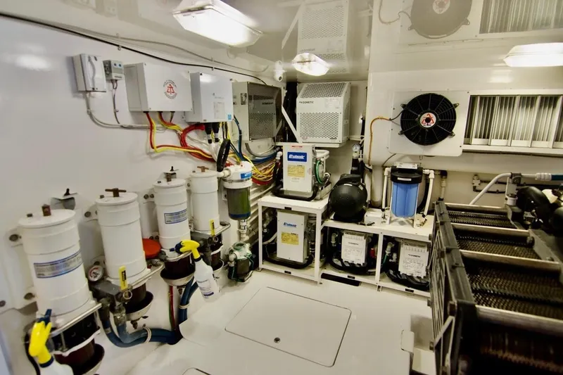 Serenity Now Yacht Photos Pics Engine room of 2014 Viking 66 Convertible yacht, featuring advanced filtration and cooling systems.