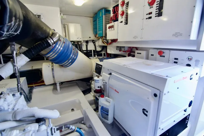 Serenity Now Yacht Photos Pics Engine room of 2014 Viking 66 Convertible yacht with Cummins Onan generator.