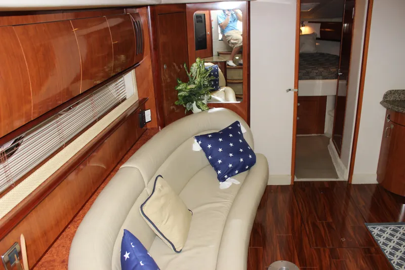  Yacht Photos Pics Interior of 2005 Sea Ray 420 Sundancer with elegant seating and wooden finishes.