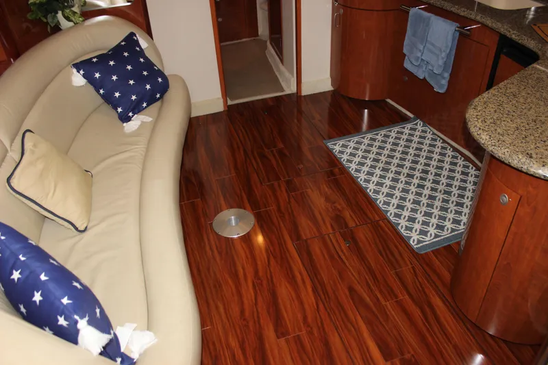  Yacht Photos Pics Luxurious interior of 2005 Sea Ray 420 Sundancer with elegant wood flooring and plush seating.