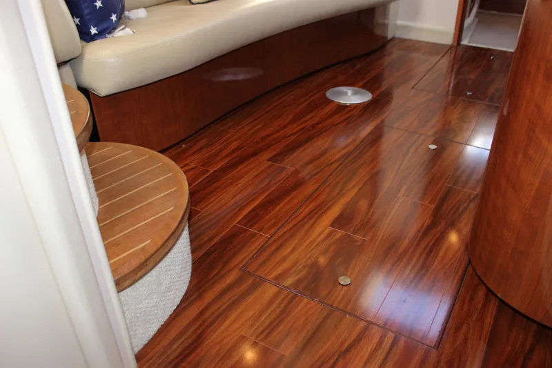  Yacht Photos Pics Interior of 2005 Sea Ray 420 Sundancer with polished wooden flooring and beige seating.