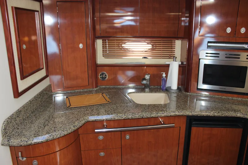  Yacht Photos Pics Luxurious kitchen interior of 2005 Sea Ray 420 Sundancer yacht with granite countertops.