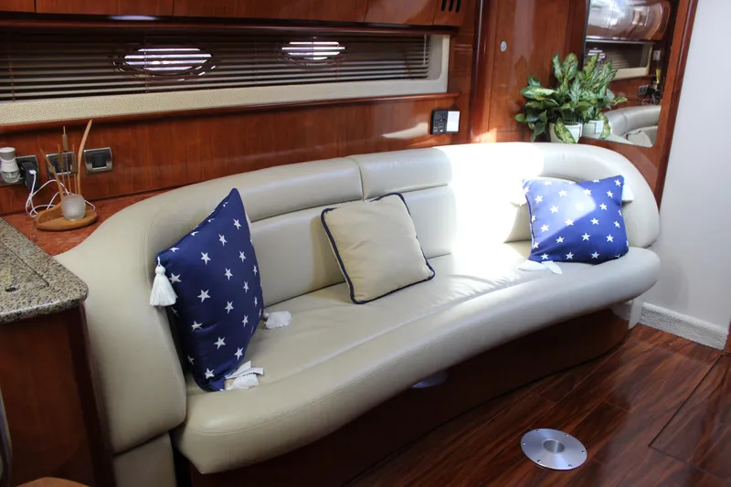  Yacht Photos Pics Luxurious interior of 2005 Sea Ray 420 Sundancer with elegant seating and star-patterned cushions.