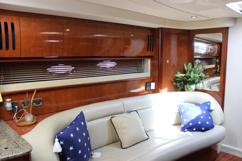  Yacht Photos Pics Luxurious interior of 2005 Sea Ray 420 Sundancer yacht with plush seating and elegant wood finishes.