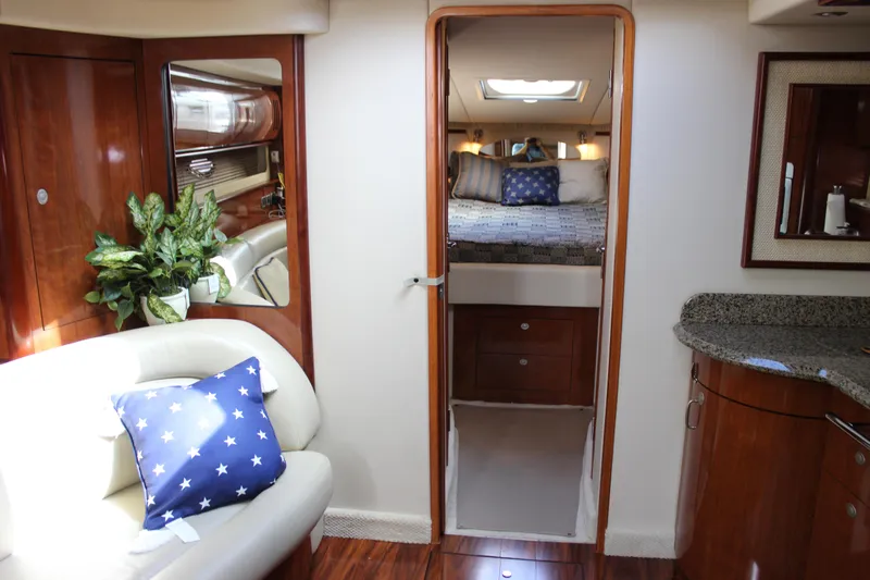  Yacht Photos Pics Interior of 2005 Sea Ray 420 Sundancer yacht with cozy seating and elegant wood finishes.