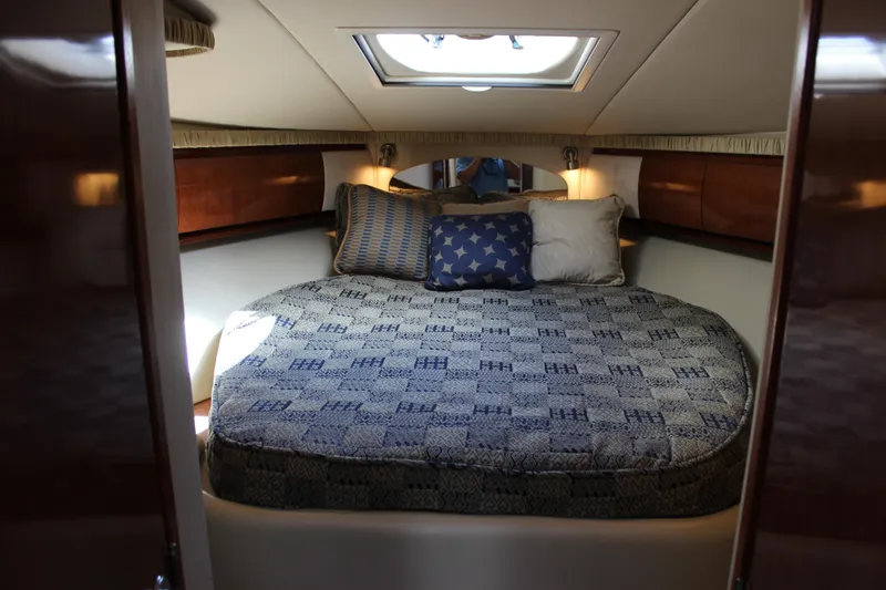  Yacht Photos Pics Luxurious cabin interior of 2005 Sea Ray 420 Sundancer yacht with cozy bedding.