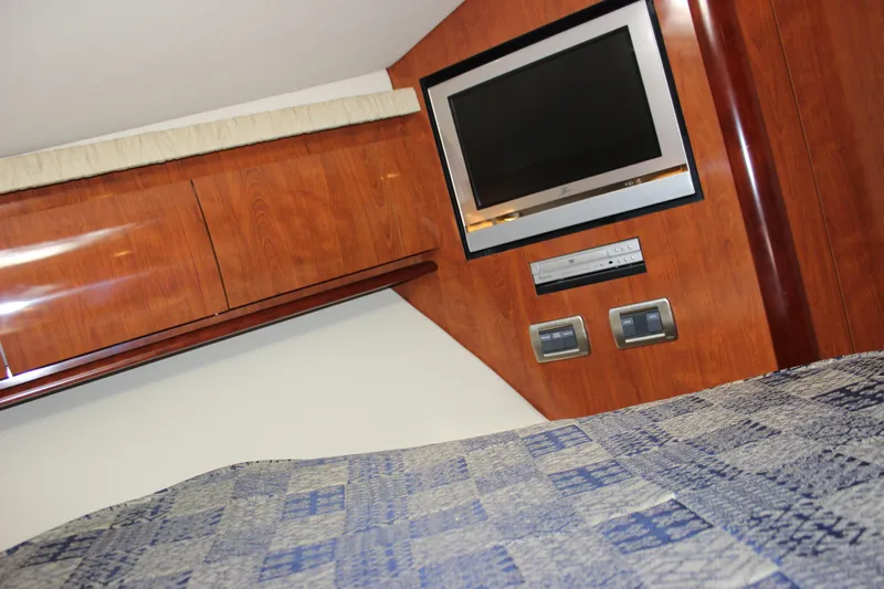  Yacht Photos Pics Interior of 2005 Sea Ray 420 Sundancer with TV and wood paneling.