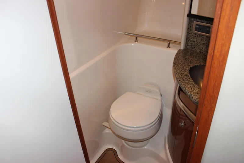  Yacht Photos Pics Bathroom interior of 2005 Sea Ray 420 Sundancer yacht with toilet and sink.
