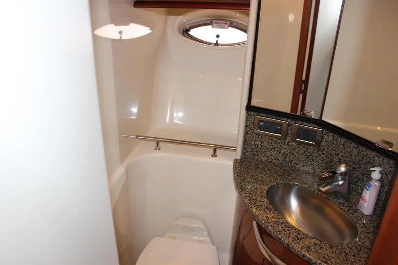  Yacht Photos Pics Luxurious bathroom in 2005 Sea Ray 420 Sundancer yacht with granite countertop and stainless steel sink.