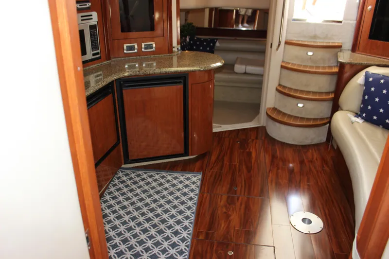  Yacht Photos Pics Interior of 2005 Sea Ray 420 Sundancer yacht with wood flooring and modern amenities.
