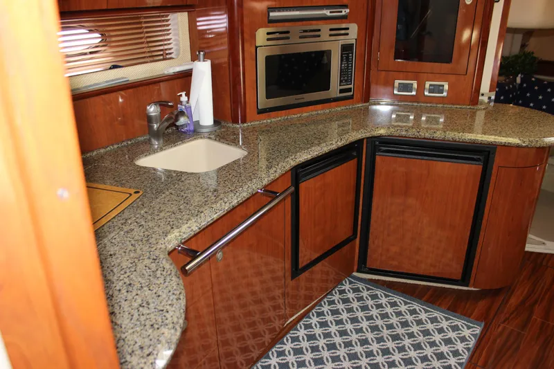  Yacht Photos Pics Luxurious kitchen interior of 2005 Sea Ray 420 Sundancer yacht with granite countertops.