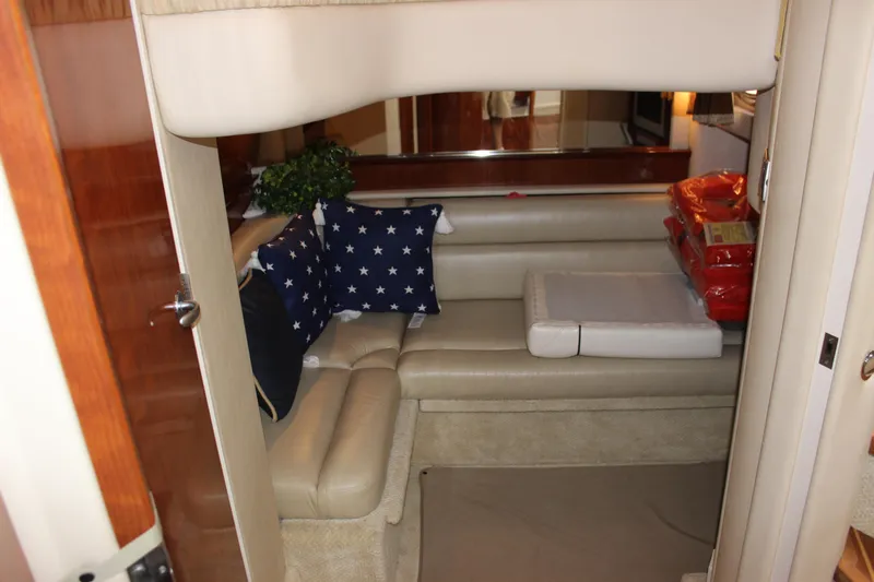  Yacht Photos Pics Interior of 2005 Sea Ray 420 Sundancer with beige seating and star-patterned pillows.