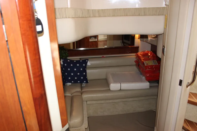  Yacht Photos Pics Interior of 2005 Sea Ray 420 Sundancer yacht with cozy seating and nautical decor.