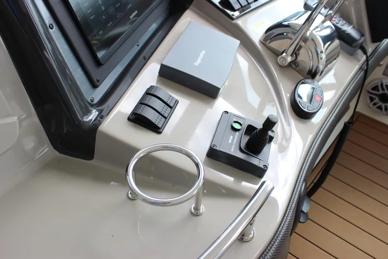  Yacht Photos Pics Control panel of 2005 Sea Ray 420 Sundancer yacht with joystick and navigation equipment.