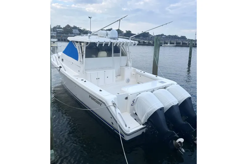  Yacht Photos Pics 2013 Pursuit OS 385 Offshore boat docked with triple outboard engines.