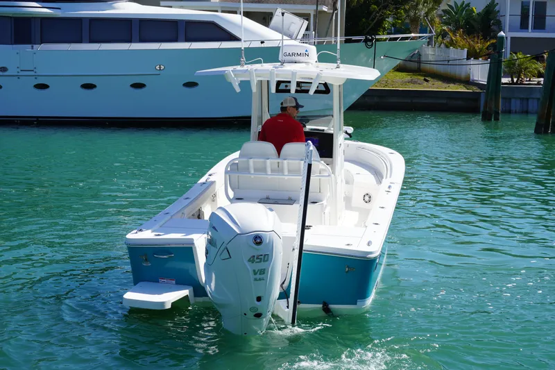  Yacht Photos Pics 2024 Regulator 26XO boat with Yamaha 450 V8 engine on turquoise water.