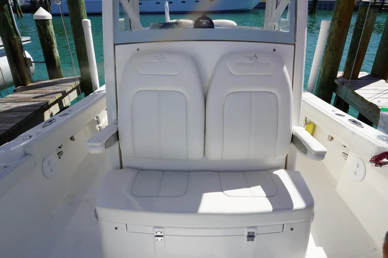  Yacht Photos Pics 2024 Regulator 26XO boat seating with white cushioned seats and armrests.