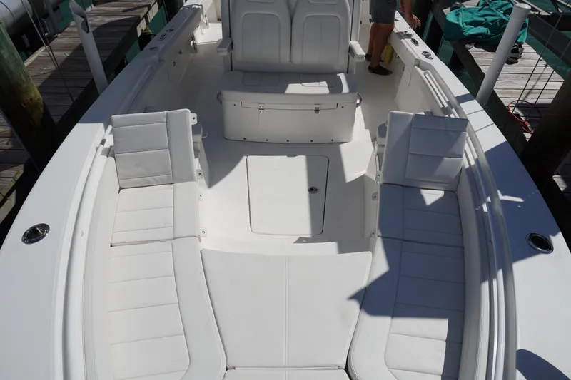  Yacht Photos Pics 2024 Regulator 26XO boat interior with white seating and spacious deck layout.
