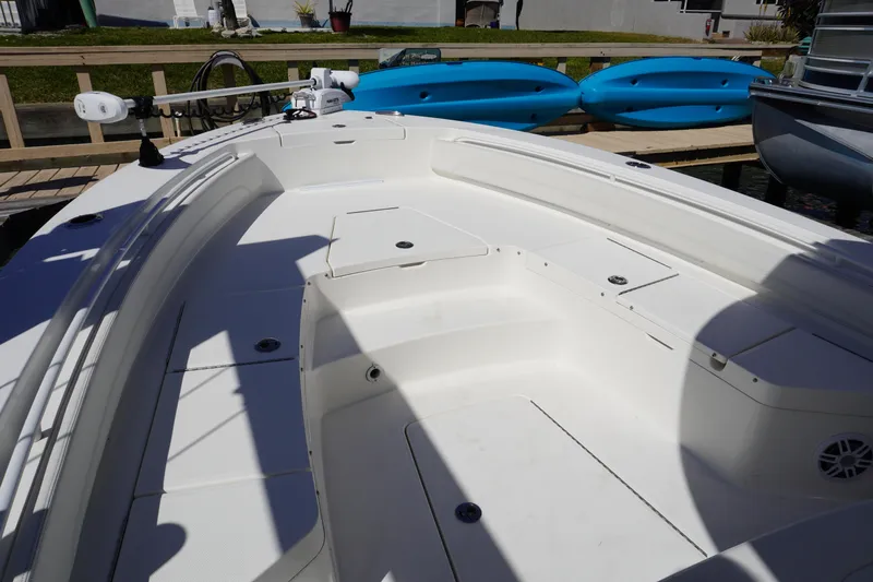  Yacht Photos Pics 2024 Regulator 26XO boat interior with spacious seating and storage compartments.