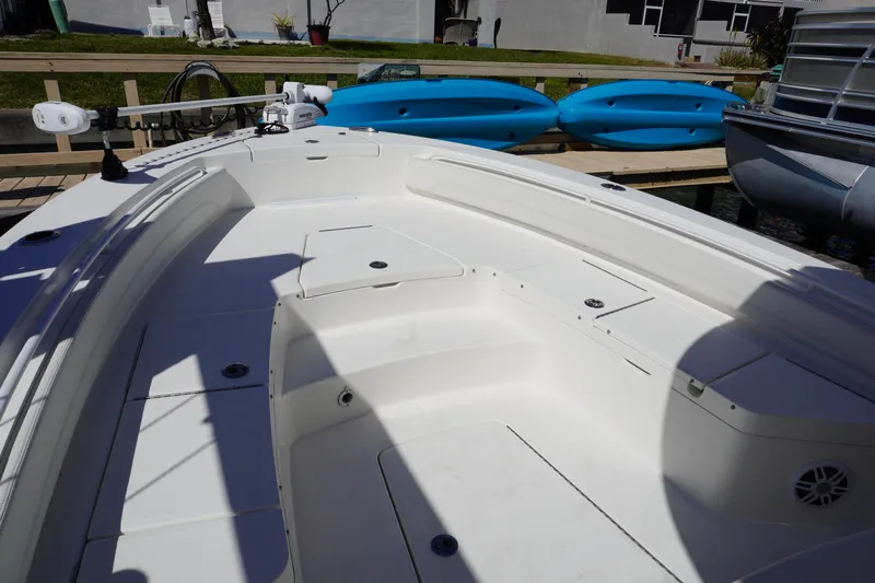  Yacht Photos Pics 2024 Regulator 26XO boat interior with seating and storage compartments.