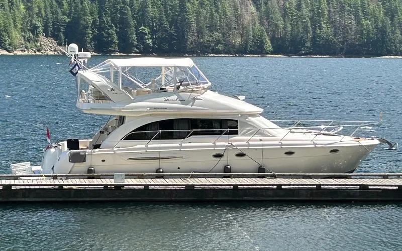 Remembrance Yacht Photos Pics 2006 Meridian 411 Sedan yacht docked on a serene lake with forest backdrop.