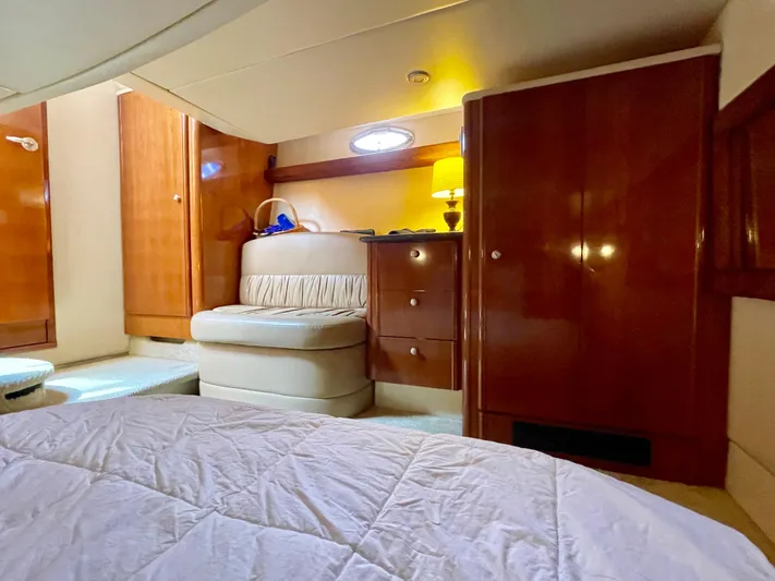 Remembrance Yacht Photos Pics Luxurious interior of 2006 Meridian 411 Sedan yacht with wood cabinetry and cozy seating.