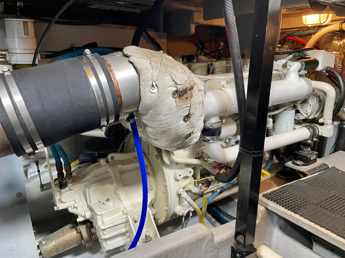 Remembrance Yacht Photos Pics Engine room of a 2006 Meridian 411 Sedan yacht, showcasing mechanical components and piping.