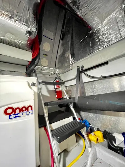 Remembrance Yacht Photos Pics Engine room of 2006 Meridian 411 Sedan with Onan generator and fire extinguisher.