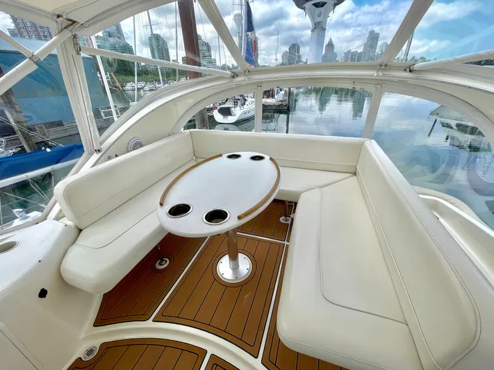 Remembrance Yacht Photos Pics 2006 Meridian 411 Sedan yacht interior with white seating and wooden table.