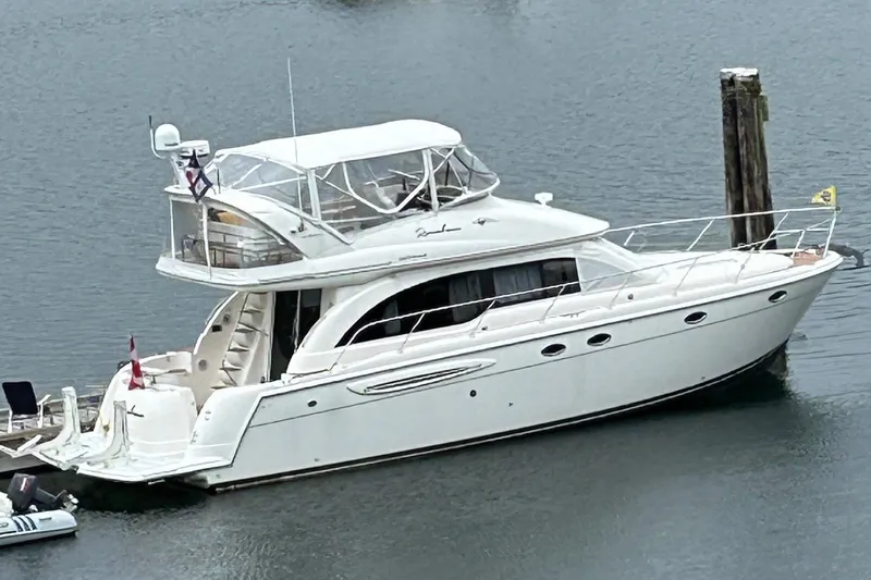 Remembrance Yacht Photos Pics 2006 Meridian 411 Sedan yacht docked on calm water.