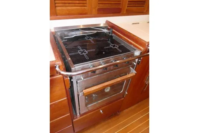 Majestic Yacht Photos Pics Stainless steel stove in 2006 Tayana 58 Deck Salon yacht kitchen.