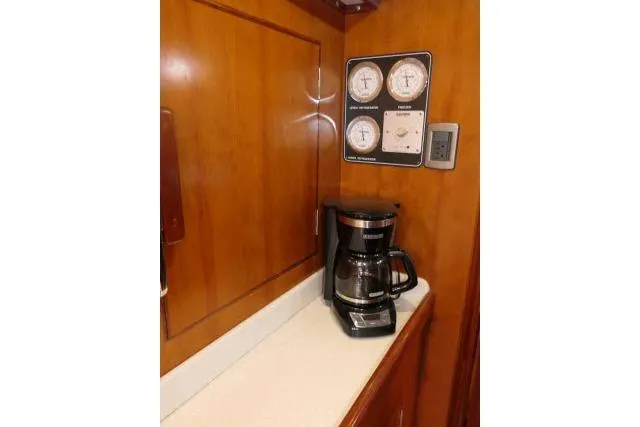 Majestic Yacht Photos Pics Coffee maker on counter in 2006 Tayana 58 Deck Salon yacht interior.