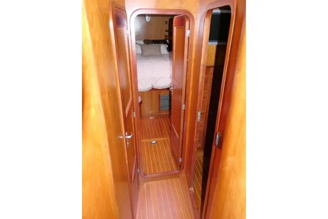 Majestic Yacht Photos Pics 2006 Tayana 58 Deck Salon interior with wooden flooring and cabin view.