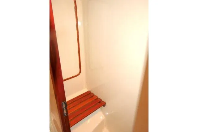 Majestic Yacht Photos Pics Shower area in 2006 Tayana 58 Deck Salon yacht with wooden floor slats.