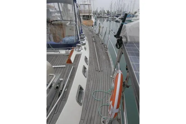 Majestic Yacht Photos Pics 2006 Tayana 58 Deck Salon yacht docked, showcasing sleek deck design and marina setting.