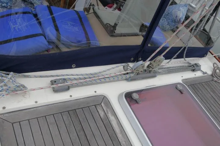 Majestic Yacht Photos Pics 2006 Tayana 58 Deck Salon sailboat deck with rigging and blue cushions.