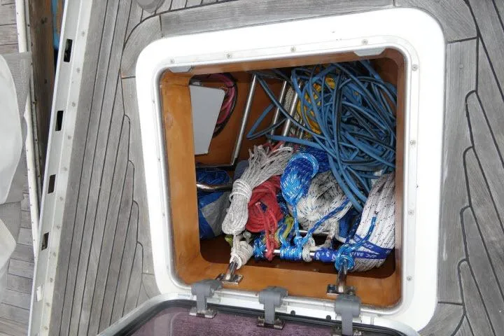 Majestic Yacht Photos Pics Storage compartment on 2006 Tayana 58 Deck Salon yacht with ropes and equipment.